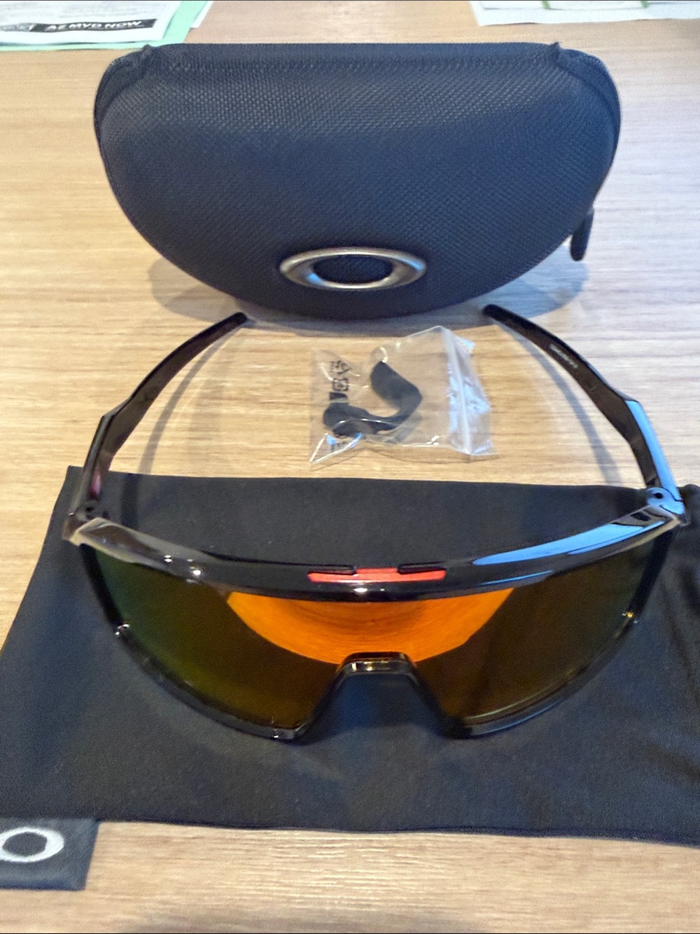 Oakley Black Frame Sunglasses with Orange Mirrored Lens Never Been Worn.